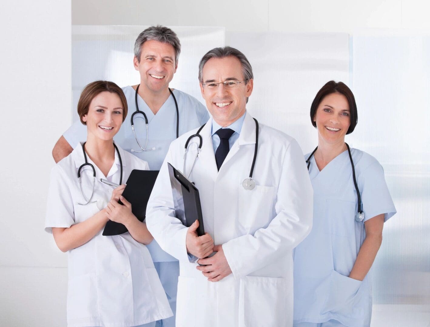 A group of doctors standing in a room.